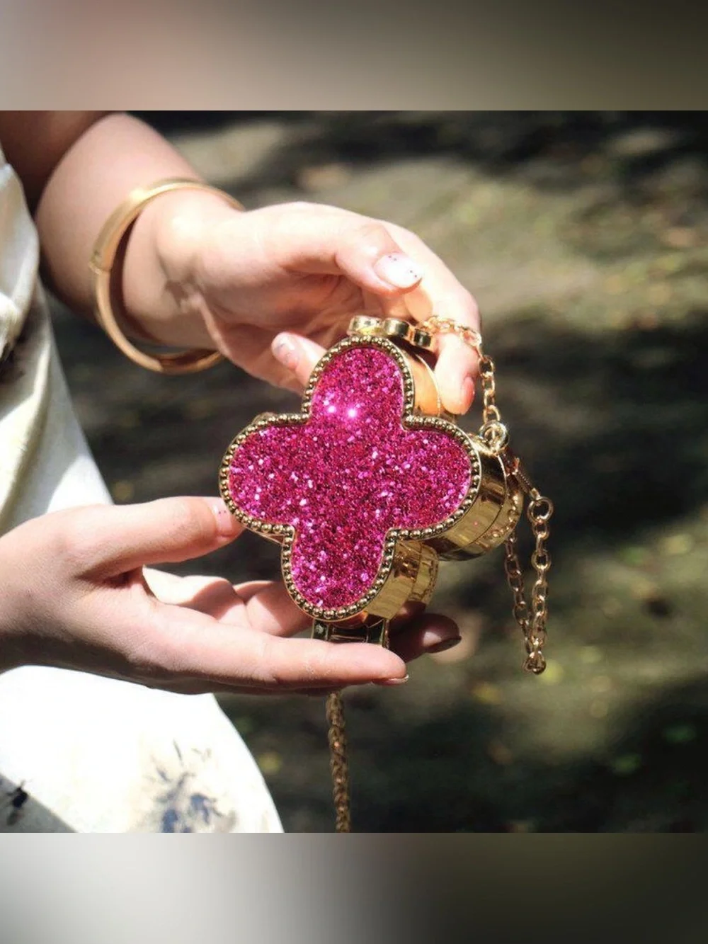A Classy Chic Boutique Gold Clutch with Pink Glitter Clover.